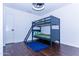 Bedroom with laminate floors featuring bunk beds and modern lighting at 9740 E Gold Dust Ave, Scottsdale, AZ 85258