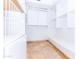 Walk-in closet with custom shelving, drawers, and ample storage, perfect for organization at 9740 E Gold Dust Ave, Scottsdale, AZ 85258
