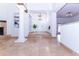 Bright foyer features stone floors, a fireplace and a decorative front door at 9740 E Gold Dust Ave, Scottsdale, AZ 85258
