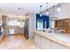 Open concept kitchen features a large island, stainless steel appliances, and backyard views at 9740 E Gold Dust Ave, Scottsdale, AZ 85258
