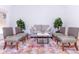 Cozy sitting area with a couch, four chairs, and decorative plants for a welcoming space at 9740 E Gold Dust Ave, Scottsdale, AZ 85258