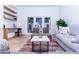 Comfortable sitting area features neutral decor, built in shelves, and travertine flooring at 9740 E Gold Dust Ave, Scottsdale, AZ 85258