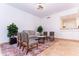 Bright sitting area with neutral decor, plants, and a view of the open floorplan at 9740 E Gold Dust Ave, Scottsdale, AZ 85258