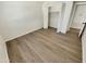 Bedroom with closet highlights durable floors, providing a clean and modern space at 9814 N Balboa Dr, Sun City, AZ 85351