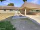 Inviting single-story home featuring a covered carport, low maintenance landscaping, and a welcoming front entrance at 9814 N Balboa Dr, Sun City, AZ 85351