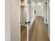 Hallway with closet showcases durable floors, leading to other rooms at 9814 N Balboa Dr, Sun City, AZ 85351