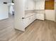 Spacious laundry room features modern cabinetry and a functional layout for convenience at 9814 N Balboa Dr, Sun City, AZ 85351