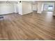 Large living area with durable floors, connecting multiple rooms at 9814 N Balboa Dr, Sun City, AZ 85351