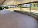 Large covered patio with decorative wall overlooks a lush golf course at 9814 N Balboa Dr, Sun City, AZ 85351
