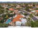 Suburban aerial view of a tile roof home showcasing desert landscape, and a backyard pool at 10435 N 98Th St, Scottsdale, AZ 85258