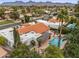 Estate aerial view showcasing mature trees, desert landscaping, swimming pool, and tile roofing at 10435 N 98Th St, Scottsdale, AZ 85258