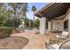 Outdoor seating on a stone patio next to the pool at 10435 N 98Th St, Scottsdale, AZ 85258