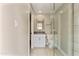 Bright bathroom featuring a modern vanity, framed mirror, and glass-enclosed shower with elegant marble-style accents at 10435 N 98Th St, Scottsdale, AZ 85258