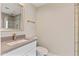 Bright bathroom with a shower with glass door, modern fixtures, and a stylish vanity with quartz countertop at 10435 N 98Th St, Scottsdale, AZ 85258