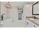 Luxurious bathroom featuring a soaking tub and walk-in closet at 10435 N 98Th St, Scottsdale, AZ 85258