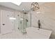Modern bathroom with a glass shower and soaking tub at 10435 N 98Th St, Scottsdale, AZ 85258