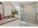 Elegant bathroom featuring a glass-enclosed shower, modern fixtures, and a stylish vanity with quartz countertop at 10435 N 98Th St, Scottsdale, AZ 85258