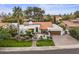 Aerial view of a Spanish-style home with a lush front lawn, gated entrance, and private courtyard at 10435 N 98Th St, Scottsdale, AZ 85258