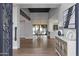 Elegant foyer showcasing hardwood floors, high ceilings, and an open floor plan leading to the dining area and pool at 10435 N 98Th St, Scottsdale, AZ 85258