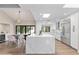 Bright open kitchen featuring a large island, modern appliances, and an adjacent dining area with outdoor views at 10435 N 98Th St, Scottsdale, AZ 85258