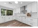 Bright kitchen featuring white cabinets, white countertops, and modern appliances at 10435 N 98Th St, Scottsdale, AZ 85258