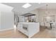 Kitchen featuring a white island, skylights, white cabinets, modern appliances, and an open floor plan at 10435 N 98Th St, Scottsdale, AZ 85258