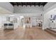 Open-concept living space showcasing hardwood floors, high ceilings, a modern kitchen, and a dining area at 10435 N 98Th St, Scottsdale, AZ 85258
