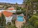 Beautiful pool surrounded by lush landscaping and view of distant mountains at 10435 N 98Th St, Scottsdale, AZ 85258