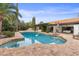 Sparkling pool reflecting the sky with views of the backyard and house at 10435 N 98Th St, Scottsdale, AZ 85258