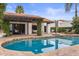 Backyard with a pristine swimming pool and outdoor seating area at 10435 N 98Th St, Scottsdale, AZ 85258