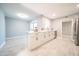 Open-concept kitchen featuring a breakfast bar and stainless steel appliances at 10523 W Roundelay Cir, Sun City, AZ 85351