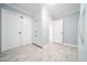 Laundry room includes appliances, additional storage, and tile-look floors at 10523 W Roundelay Cir, Sun City, AZ 85351