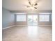 Bright and open living room with sliding doors leading to the backyard patio at 10523 W Roundelay Cir, Sun City, AZ 85351