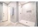 Contemporary tiled shower features a shower niche, neutral color palette and updated fixture at 10523 W Roundelay Cir, Sun City, AZ 85351