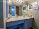 Well-lit bathroom featuring ample vanity space, large mirror, and a classic design with a neutral color palette at 11666 N 28Th Dr # 298, Phoenix, AZ 85029