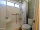 Accessible bathroom with safety bars, walk-in shower, and convenient shelves for toiletries in a bright space at 11666 N 28Th N Dr # 298, Phoenix, AZ 85029