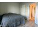 Cozy bedroom features a comfortable bed and access to an open closet at 11666 N 28Th Dr # 298, Phoenix, AZ 85029