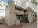 Multi-level condo building featuring private balconies, exterior staircases, and desert-friendly landscaping at 11666 N 28Th Dr # 298, Phoenix, AZ 85029