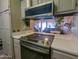 Modern kitchen featuring a smooth cooktop and stainless steel appliances at 11666 N 28Th Dr # 298, Phoenix, AZ 85029