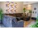 A comfortable grey couch resides in the living room, decorated with plants and Minnesota Vikings paraphernalia at 11666 N 28Th Dr # 298, Phoenix, AZ 85029