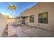 Backyard with a covered patio area, perfect for outdoor entertaining, xeriscape, and palm trees at 11772 E Clinton St, Scottsdale, AZ 85259