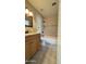 This bathroom features a single vanity and a tub with shower at 11772 E Clinton St, Scottsdale, AZ 85259