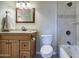 Bathroom featuring a sink, granite countertop, and tiled bath/shower at 11772 E Clinton St, Scottsdale, AZ 85259