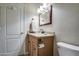 Bathroom featuring a vanity with granite countertop and a sink at 11772 E Clinton St, Scottsdale, AZ 85259