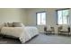 This bedroom has a carpet floor, neutral colors, and lots of natural light at 11772 E Clinton St, Scottsdale, AZ 85259