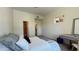 Spacious bedroom boasts a comfortable bed, ensuite bathroom and walk-in closet at 11772 E Clinton St, Scottsdale, AZ 85259