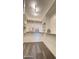 This walk in closet has shelving, carpet floors, and lighting at 11772 E Clinton St, Scottsdale, AZ 85259