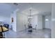 Well-lit dining space showcasing a decorative chandelier and tiled floors, perfect for gatherings at 11772 E Clinton St, Scottsdale, AZ 85259