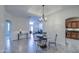 Bright dining area featuring tiled floors, modern lighting, and easy access to other rooms at 11772 E Clinton St, Scottsdale, AZ 85259