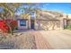 Charming single-story home with well-maintained landscaping and a two-car garage at 11772 E Clinton St, Scottsdale, AZ 85259